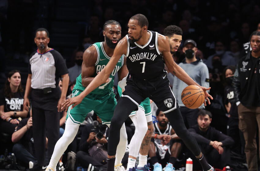 NEW YORK, NEW YORK - APRIL 23: Kevin Durant #7 of the Brooklyn Nets dribbles against Jaylen Brown #7 of the Boston Celtics during Game Three of the Eastern Conference First Round NBA Playoffs at Barclays Center on April 23, 2022 in New York City. NOTE TO USER: User expressly acknowledges and agrees that, by downloading and or using this photograph, User is consenting to the terms and conditions of the Getty Images License Agreement. (Photo by Al Bello/Getty Images).
