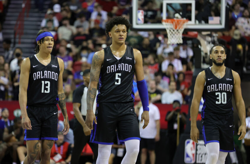 LAS VEGAS, NEVADA - JULY 09: R.J. Hampton #13, Paolo Banchero #5 and Devin Cannady #30 of the Orlando Magic walk on the court during a break in a game against the Sacramento Kings during the 2022 NBA Summer League at the Thomas & Mack Center on July 09, 2022 in Las Vegas, Nevada. NOTE TO USER: User expressly acknowledges and agrees that, by downloading and or using this photograph, User is consenting to the terms and conditions of the Getty Images License Agreement. (Photo by Ethan Miller/Getty Images)